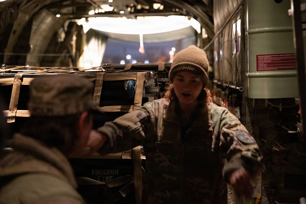 Kentucky Air National Guard Airman TSgt. Emily Browning directs members of the 147th South Dakota Army National Guard band members