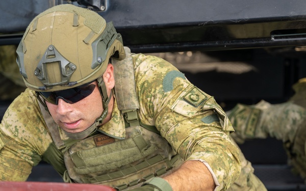 Coalition forces conduct close quarters combat training during Exercise Ferocious Falcon 6