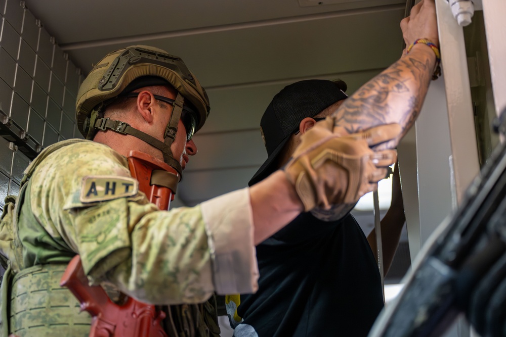 Coalition forces conduct close quarters combat training during Exercise Ferocious Falcon 6