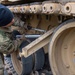 U.S. Army Soldier performs maintenance on an M1 Abrams