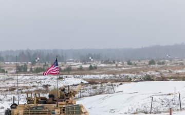 U.S. Soldiers prepare to fire an M1 Abrams tank during the Iron Spear Tank Competition