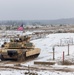 U.S. Soldiers prepare to fire an M1 Abrams tank during the Iron Spear Tank Competition