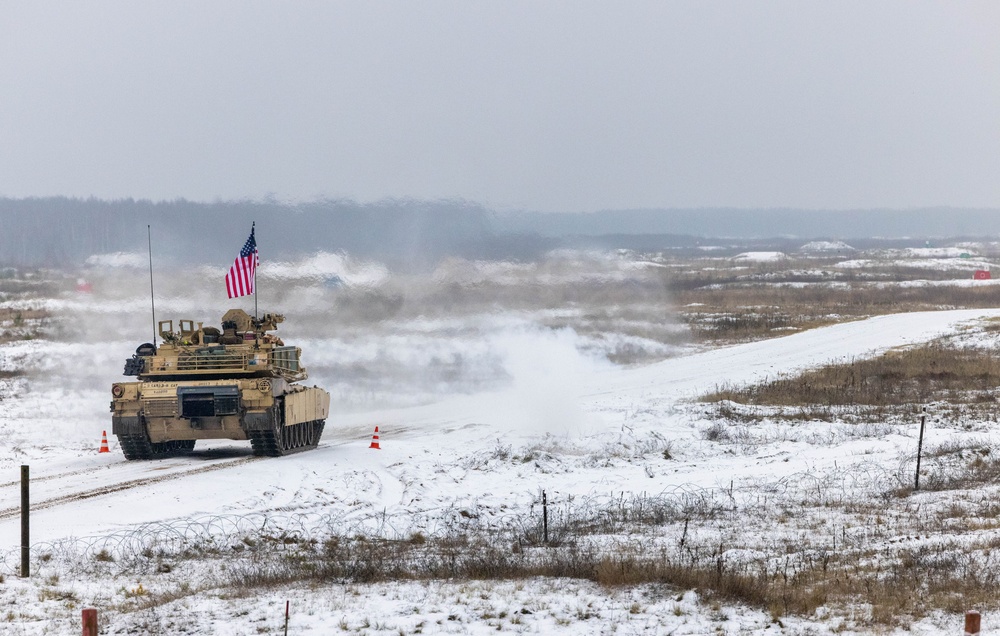 U.S. Soldiers fire an M1 Abrams tank during the Iron Spear Tank Competition