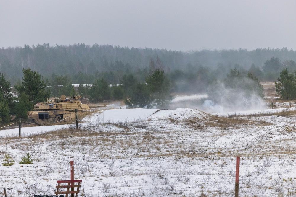 U.S. Soldiers fire an M1 Abrams tank during the Iron Spear Tank Competition