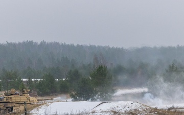 U.S. Soldiers fire an M1 Abrams tank during the Iron Spear Tank Competition