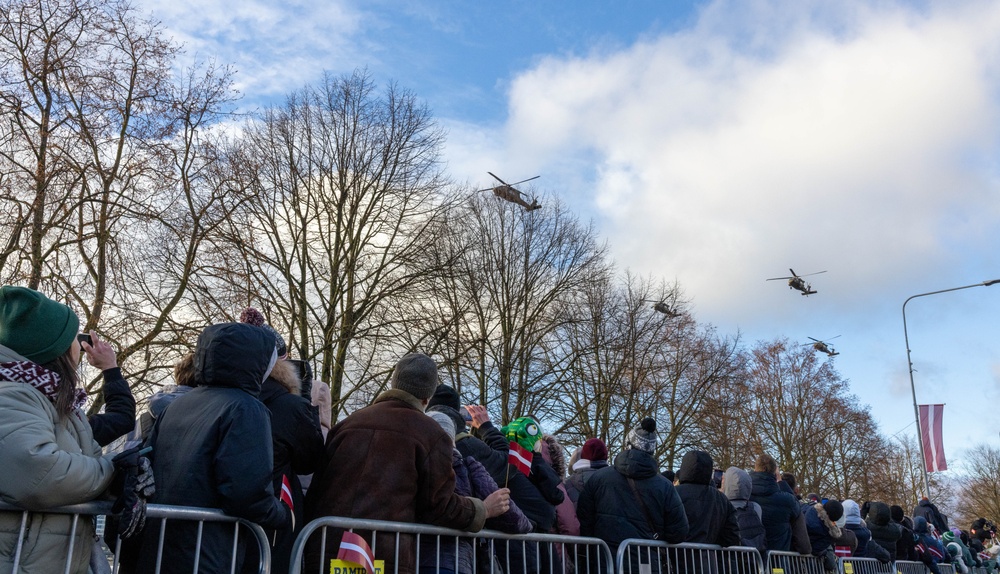 U.S. Army UH-60 Blackhawks fly over Latvia’s Independence Day parade