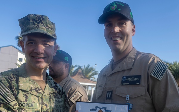 Adm. Brad Cooper, Presents Joint Awards with “R” Device to USS The Sullivans (DDG 68)