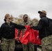 Sailors distribute meals for thanksgiving
