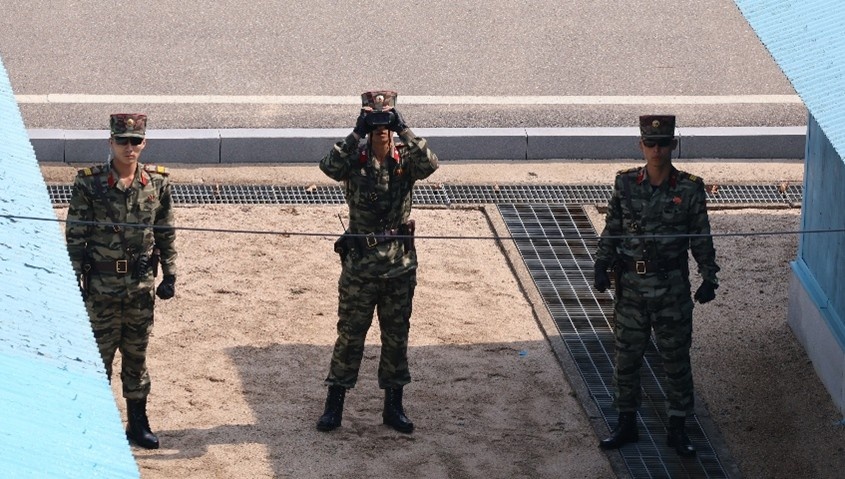 North Korean soldiers observe personnel in Joint Security Area