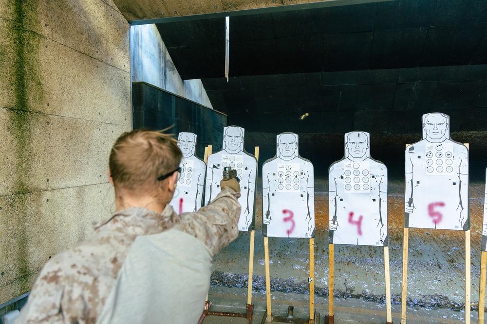 A Reconnaissance Marine with the 24th Marine Expeditionary Unit conducts one-handed pistol shooting drills