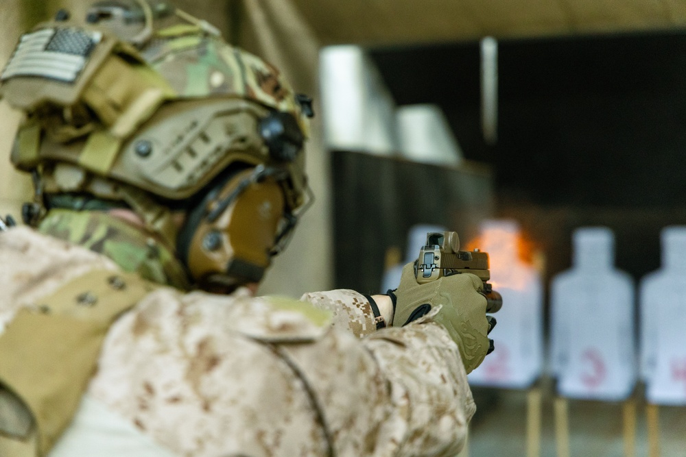 Reconnaissance Marines with the 24th Marine Expeditionary Unit conduct pistol shooting drills