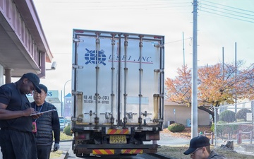 Workers unload fresh food at the Market 19 dining facility