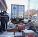 Workers unload fresh food at the Market 19 dining facility