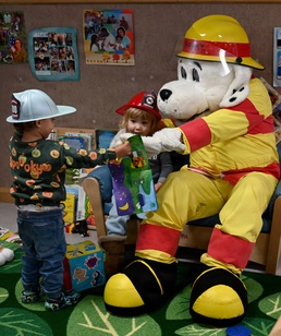 Sparky and friends read at CDC during Fire Prevention Week 2025