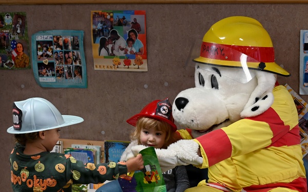 Sparky and friends read at CDC during Fire Prevention Week 2025