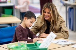 First Lady Melania Trump Helps Student Create Cardstock Turkey at DoDEA Americas DeLalio Elementary School