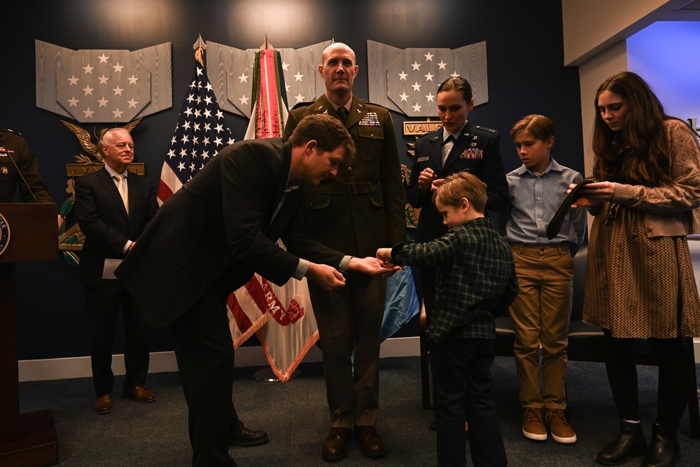 Family Assists During Pinning at Reinstatement Ceremony
