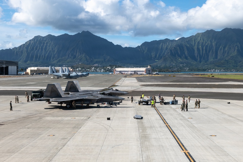 Total Force Airmen Execute Integrated Combat Turn for F-22 Raptors