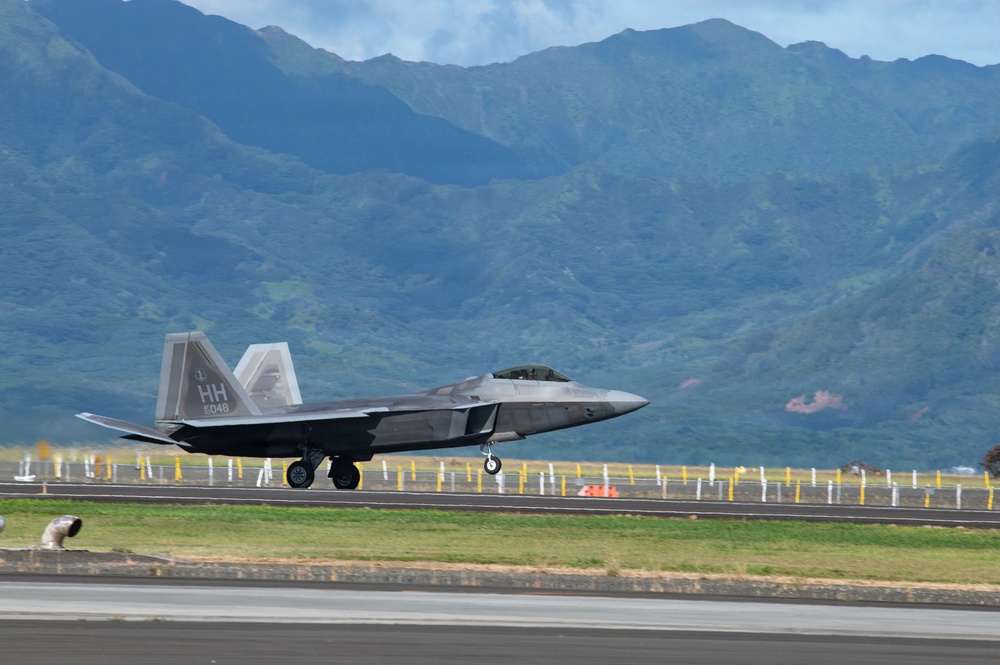 Total Force Airmen Execute Integrated Combat Turn for F-22 Raptors