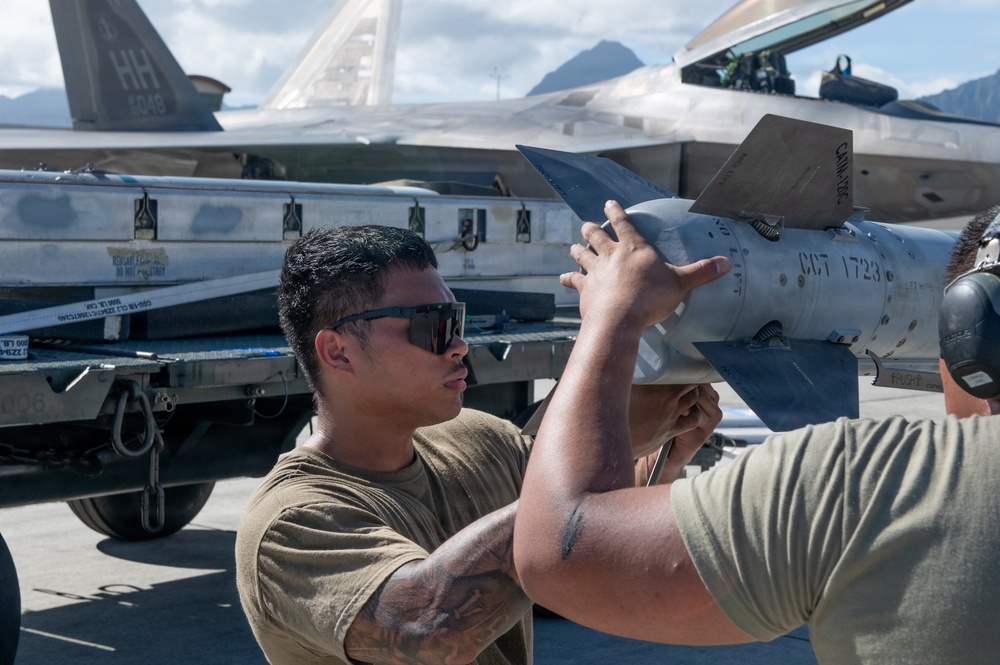 Total Force Airmen Execute Integrated Combat Turn for F-22 Raptors