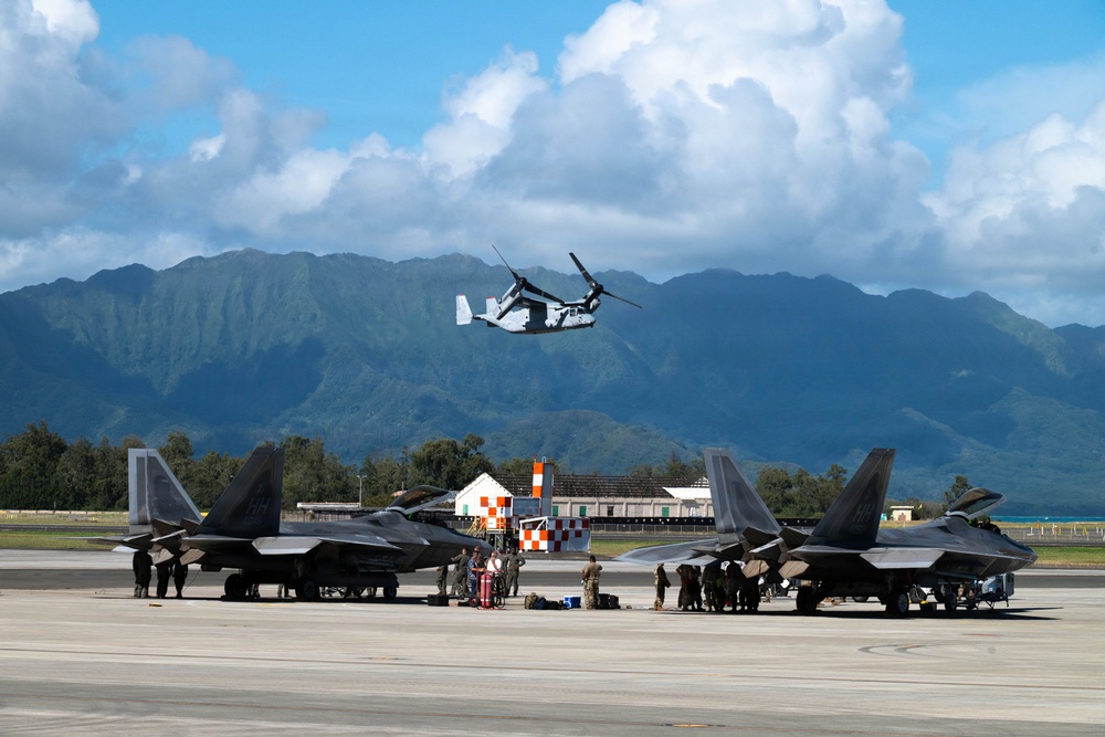 Total Force Airmen Execute Integrated Combat Turn for F-22 Raptors