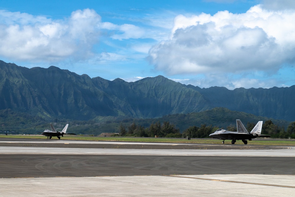 Total Force Airmen Execute Integrated Combat Turn for F-22 Raptors