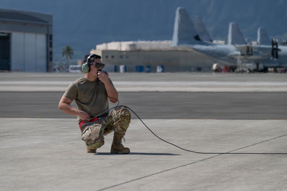 Total Force Airmen Execute Integrated Combat Turn for F-22 Raptors