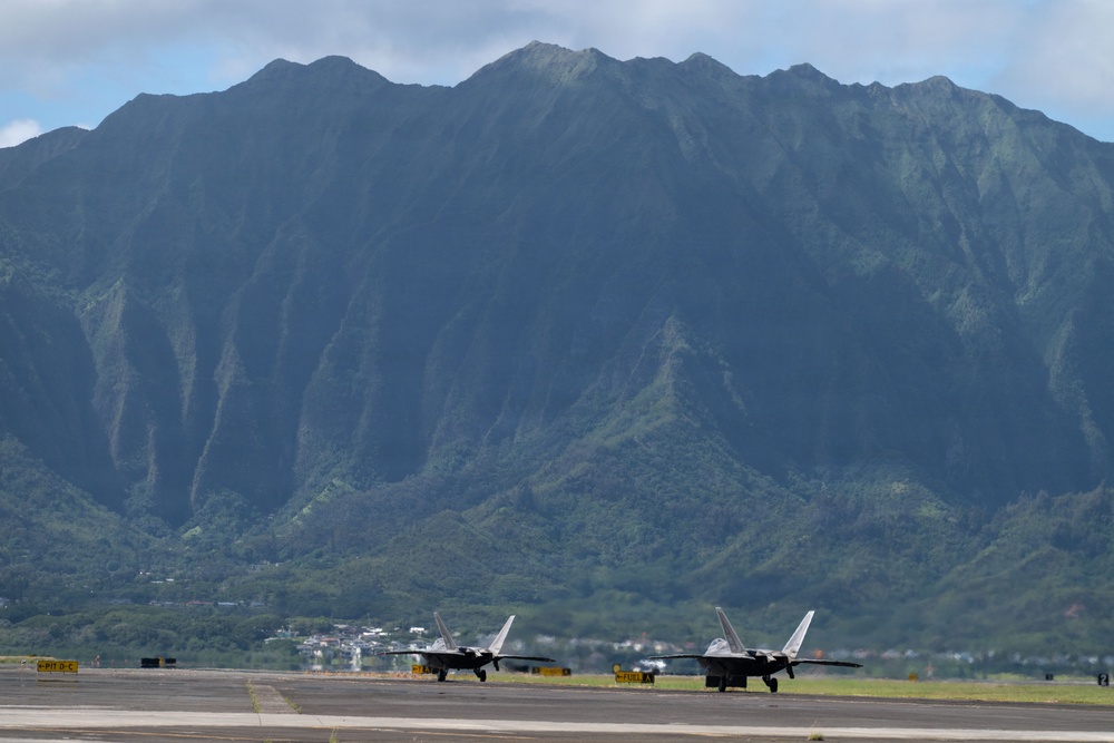 Total Force Airmen Execute Integrated Combat Turn for F-22 Raptors