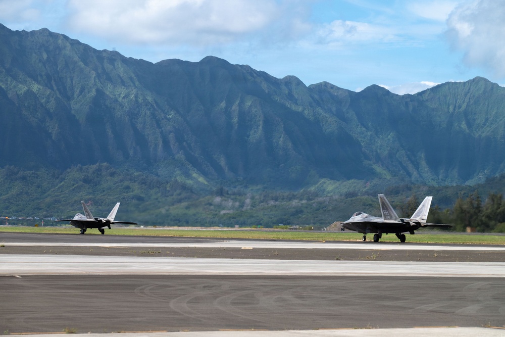 Total Force Airmen Execute Integrated Combat Turn for F-22 Raptors