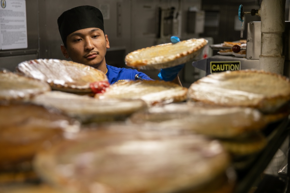 USS Mitscher (DDG 57) Sailor prepares food for Thanksgiving