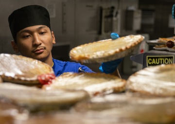 USS Mitscher (DDG 57) Sailor prepares food for Thanksgiving