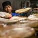 USS Mitscher (DDG 57) Sailor prepares food for Thanksgiving