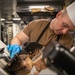 USS Mitscher (DDG 57) Sailor prepares Thanksgiving food
