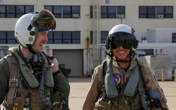 Lara Trump walks out to the flight line with Lt. Ryan “Narp” Hubbs assigned to Strike Fighter Squadron (VFA) 106