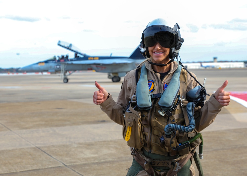 Lara Trump poses in front of F/A-18F Super Hornet aircraft