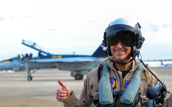 Lara Trump poses in front of F/A-18F Super Hornet aircraft