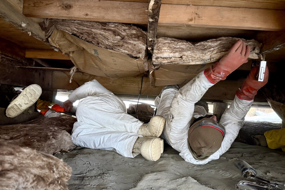 AKOM members clear debris at Tuntutuliak Operation Halong Response