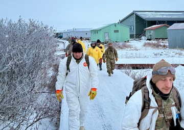 AKOM members clear debris at Tuntutuliak Operation Halong Response