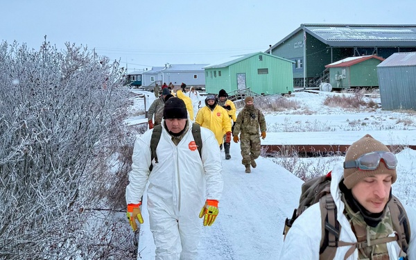 AKOM members clear debris at Tuntutuliak Operation Halong Response