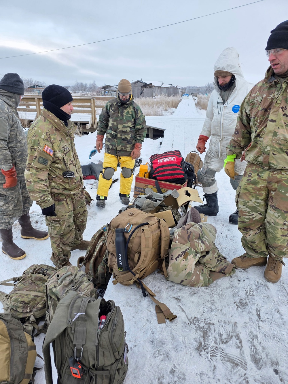 AKOM members clear debris at Tuntutuliak Operation Halong Response