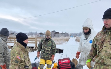 AKOM members clear debris at Tuntutuliak Operation Halong Response