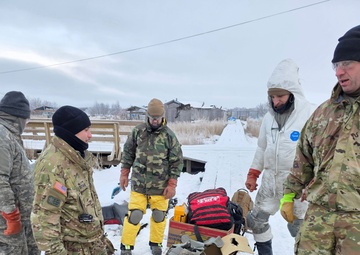 AKOM members clear debris at Tuntutuliak Operation Halong Response