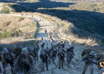 Headquarters Company, 5th Marines participate in conditioning hike