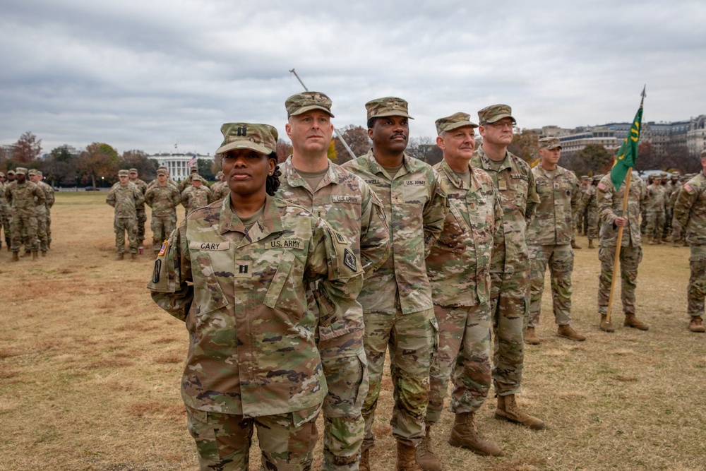 Joint Task Force Magnolia service members take a photo in front of the White House
