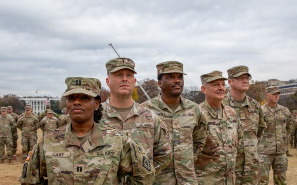 Joint Task Force Magnolia service members take a photo in front of the White House