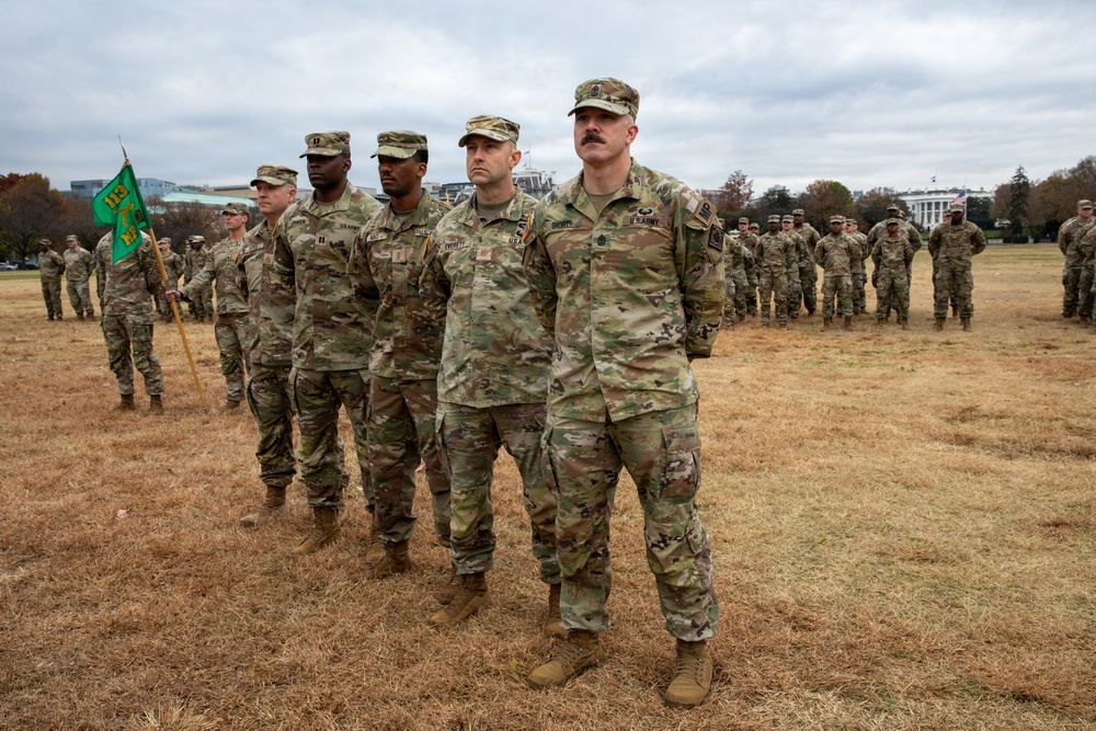 Joint Task Force Magnolia service members take a photo in front of the White House