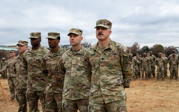 Joint Task Force Magnolia service members take a photo in front of the White House