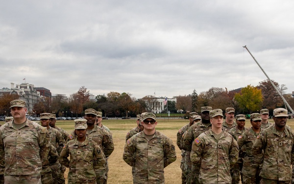 112th Military Police Battalion service members take a photo in front of the White House