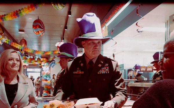 Compassion in Action: Commander and Spouse Help Civilian During Holiday Dining Facility Service