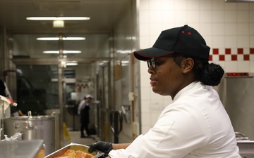 Thanksgiving Service Begins Early as Soldier Prepares Meals for Fellow Soldiers